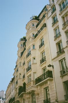 an old building with balconies on the top floor and balconyes above it