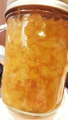 a jar filled with food sitting on top of a stove