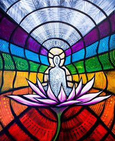 a stained glass window with a person sitting on the lotus