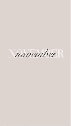 the word november written in black on a gray background