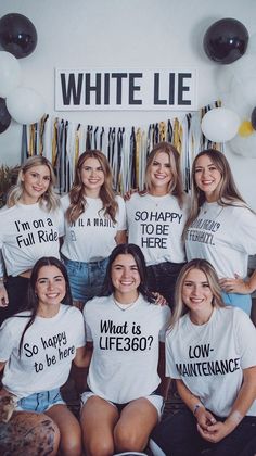 a group of women sitting next to each other wearing t - shirts that say white lie