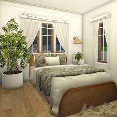 a bed sitting in a bedroom next to a window with white curtains and potted plants