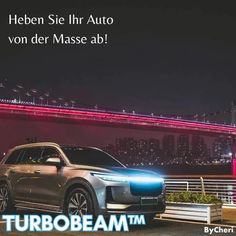 a silver car parked in front of a bridge with the words turbobeam on it