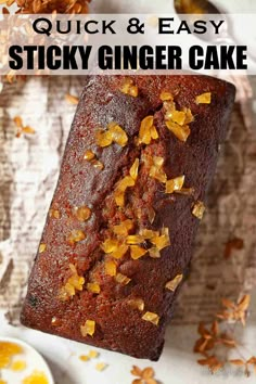 quick and easy sticky ginger cake on a white plate with orange zest sprinkles