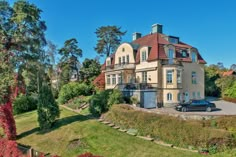 a large house with a car parked in front of it