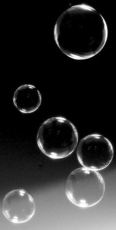 three bubbles floating in the air next to each other