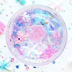 a cup filled with lots of different colored confetti