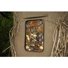 an outhouse with some plants growing on it