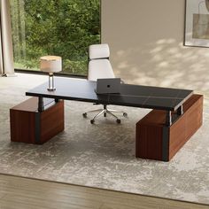 an office desk with a laptop computer on it in front of a large window overlooking the woods