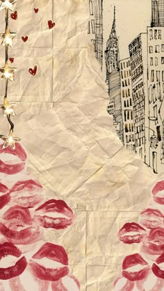 a piece of paper with red lipstick on it and buildings in the background that have hearts drawn on them