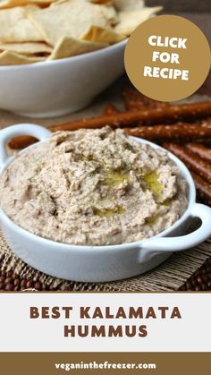 hummus in a bowl with crackers on the side and text overlay that reads best kalamata hummus