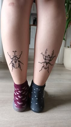 two legs with small tattoos on them