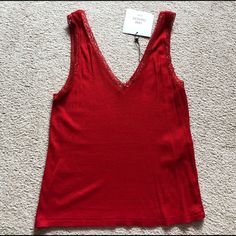 Zara Trafaluc Basic Red V Neck Ribbed Camisole Lace Trim Tank Top Tee Size Small New With Tags. Red Stretch V-neck Tank Top, Red Stretch Cami Top, Red Stretch Camisole For Spring, Elegant Red Cami Tank Top, Elegant Red Camisole Top, Fitted Red V-neck Tank Top, Fitted Red V-neck Camisole, Elegant Red V-neck Tank Top, Red Stretch Tops By Zara