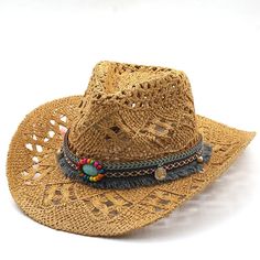 a straw hat with beaded accents on the brim and fringe around the brim