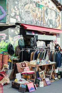 an outdoor clothing store with clothes on display