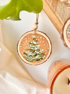 This year I wanted to make something handmade for Christmas. So I made these hand painted wood slice ornaments! I loved the idea of having a piece of nature and art in your home. I'm so happy with how they turned out despite not having much experience with acrylics! (I mainly paint with watercolours). It's always fun to experiment and learn new things (despite what perfectionism says!) Every one of them is hand-painted with love and joy. I hope these uniquely painted ornaments can make your Christmas season extra special! 🌱 Details: - Ornaments made of natural wood slices - Hand painted with acrylic paint. The paint is protected with a varnish. - Measurements: diameter of 8-9cm (3.1 - 3.5 inch) - Thickness: 0.8cm (0.3 inch) - Secured with twine to hang on the tree with ease - Artwork is p Wood Slice Ornament Painted, Wood Slice Ornament Ideas, Handmade For Christmas, Painted Wood Slice Ornaments, Christmas Wood Ornaments, Ornament Painting, Decoration Nature