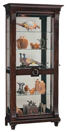 a wooden display case with glass shelves filled with vases and figurines in it