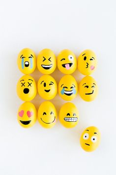 several yellow balls with different emoticions and faces on them, all arranged in the same pattern