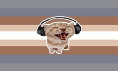 a cat wearing headphones with its mouth wide open and it's tongue out