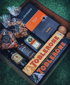 an open box filled with liquor and snacks