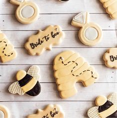 decorated cookies that say bride to be and are on a white wooden table with the words bride to be