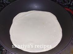 a pan filled with food sitting on top of a stove