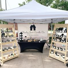 an outdoor display with candles under a tent