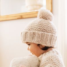 Thick, soft beanie in is hand knit in garter stitch with a ribbed cuff and pom pom on tip. Hand-knit, in natural colored yarn, it is cozy and warm. The matching sweater you see here is available separately. Perfect for chilly weather and a great gift!• 100% Acrylic • Cold handwash• Handknit in China Cloth Diaper Storage, Girls Beanie Hats, Girls Knit Hat, Diaper Storage, Girl Beanie, Boys Knits, Matching Sweaters, Crochet Girls, Wet Bag