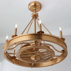 a chandelier hanging from the ceiling with four lights on each side and an air vent in the middle