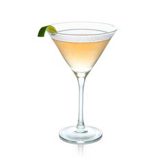 a martini glass with a lime garnish on the rim and a white background