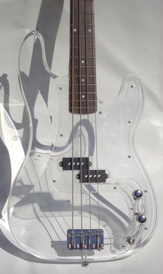 an electric bass guitar is shown on display