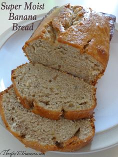 two slices of banana bread on a white plate with the words super moist banana bread