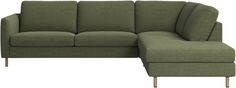 a green couch with a footstool sitting next to it