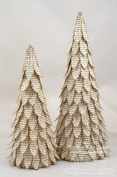 two small trees made out of book pages