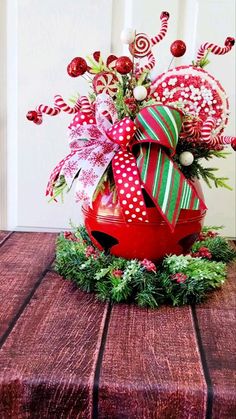 a christmas decoration with candy canes and bows