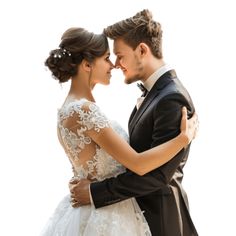 a bride and groom embracing each other in front of a white background for their wedding photo