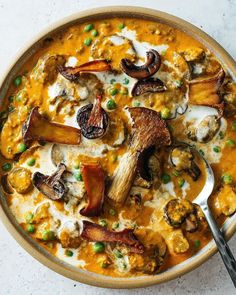 a bowl filled with food and a spoon