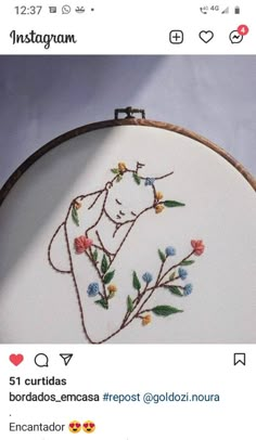 the embroidery is being worked on by someone