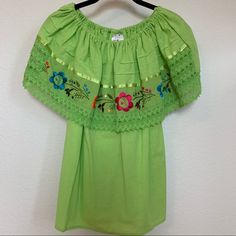 Mexican Embroidered Ruffle Blouse. Bright Green Color. Can Be Worn Off The Shoulder Or On Top. Very Cute And Light Weight. No Size Marked, But Would Probably Best Fit Size Small. Never Worn, In Great Condition! Green Short Sleeve Peasant Top For Spring, Bright Green Color, Mexican Blouse, Bright Green, Green Color, Green Colors, Off The Shoulder, Ruffle Blouse, Top Blouse