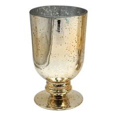 a silver and gold colored cup on a white background, with small speckles all over it