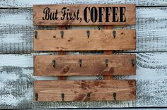 a wooden sign that says but first, coffee