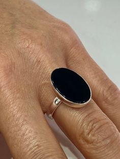 Silver Oval Onyx Ring , Natural Black Onyx Ring , Minimalist Ring , Handmade Women Onyx Ring , 925k Sterling Silver Onyx Ring ★Item Details * Material : 925K Sterling Silver * Total weight : 5 Gram * Gemstone : Onyx Stone ✔ Ready to Ship in 1-2 Business Days .. ✔ Shipped to the Worldwide 1-5 business days with free shipping... ✔ The product will be sent to you with a handmade wooden box to avoid any damage during shipping... ✔ Visit our store, browse other Men's jewelry, silver and gold collecti Minimalist Black Oval Rings, Everyday Black Sterling Silver Signet Ring, Minimalist Onyx Oval Ring, Handmade Wooden Boxes, Black Onyx Ring, Ring Minimalist, Minimalist Ring, Onyx Ring, Onyx Stone