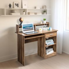 a laptop computer sitting on top of a wooden desk next to a book shelf filled with books