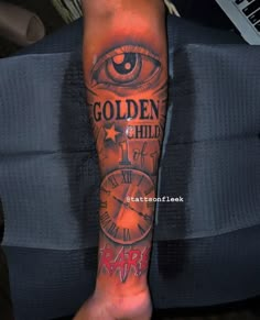 a person with a tattoo on their leg that says golden child and an all seeing clock