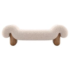 a white dog bed with wooden legs and a long tail on it's back