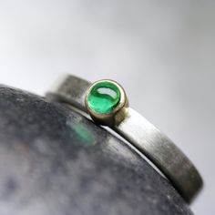 Modern Colombian Emerald Engagement Ring Solid Silver 18K Yellow Gold Minimalistic Green Cabochon - Beryl Dome by NangijalaJewelry on Etsy Modern Oval Green Jewelry, Modern Round Emerald Ring For Formal Occasions, Modern Polished Emerald Ring For Anniversary, Modern Bezel-set Emerald Ring For Anniversary, Modern Emerald Ring With Bezel Setting For Anniversary, Modern Emerald Ring With Bezel Setting For Formal Occasions, Modern Emerald Ring With Bezel Setting For Formal Events, Classic Green Ring With Smooth Bezel, Modern White Gold Emerald Ring With Bezel Setting