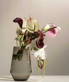 a vase filled with flowers on top of a table