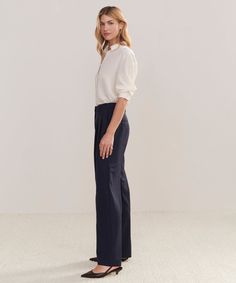 Wool Jones Trouser Navy Our take on classic Italian suiting comes to life in the form of a trouser designed to replace every pant in your wardrobe. With elevated tailoring and all-day comfort, this trouser is an all-purpose pant in disguise. Style with a t-shirt and sneakers or a kitten heel and silk shirt—the outfit options are endless. 95% wool, 5% elastane. Made in China of Italian fabric. Double pleat Italian trouser with relaxed-straight leg. | Jenni Kayne Women's Wool Jones Trouser Size 10 Outfit Options, Italian Suit, Trouser Design, Jenni Kayne, In Disguise, The Outfit, Classic Italian, Italian Fabric, Slipper Boots