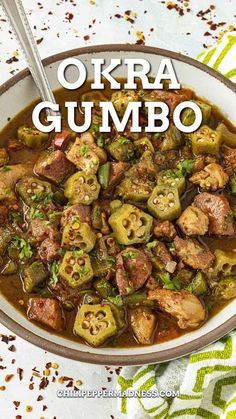 okra gumbo in a bowl with spoon