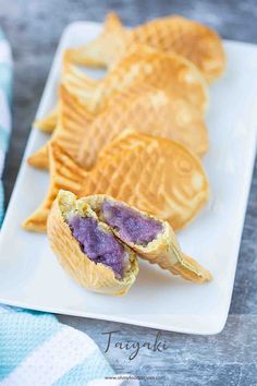 some waffles on a white plate with blueberries